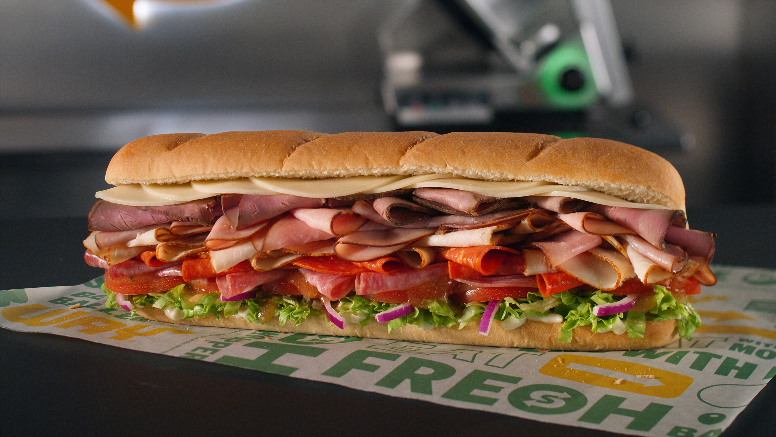 The Beast (#10) includes a half pound of meat with freshly sliced turkey, ham, roast beef, pepperoni and salami, topped with double provolone cheese, lettuce, tomato, red onion and mayonnaise, served on Artisan Italian bread and drizzled with MVP Parmesan Vinaigrette.