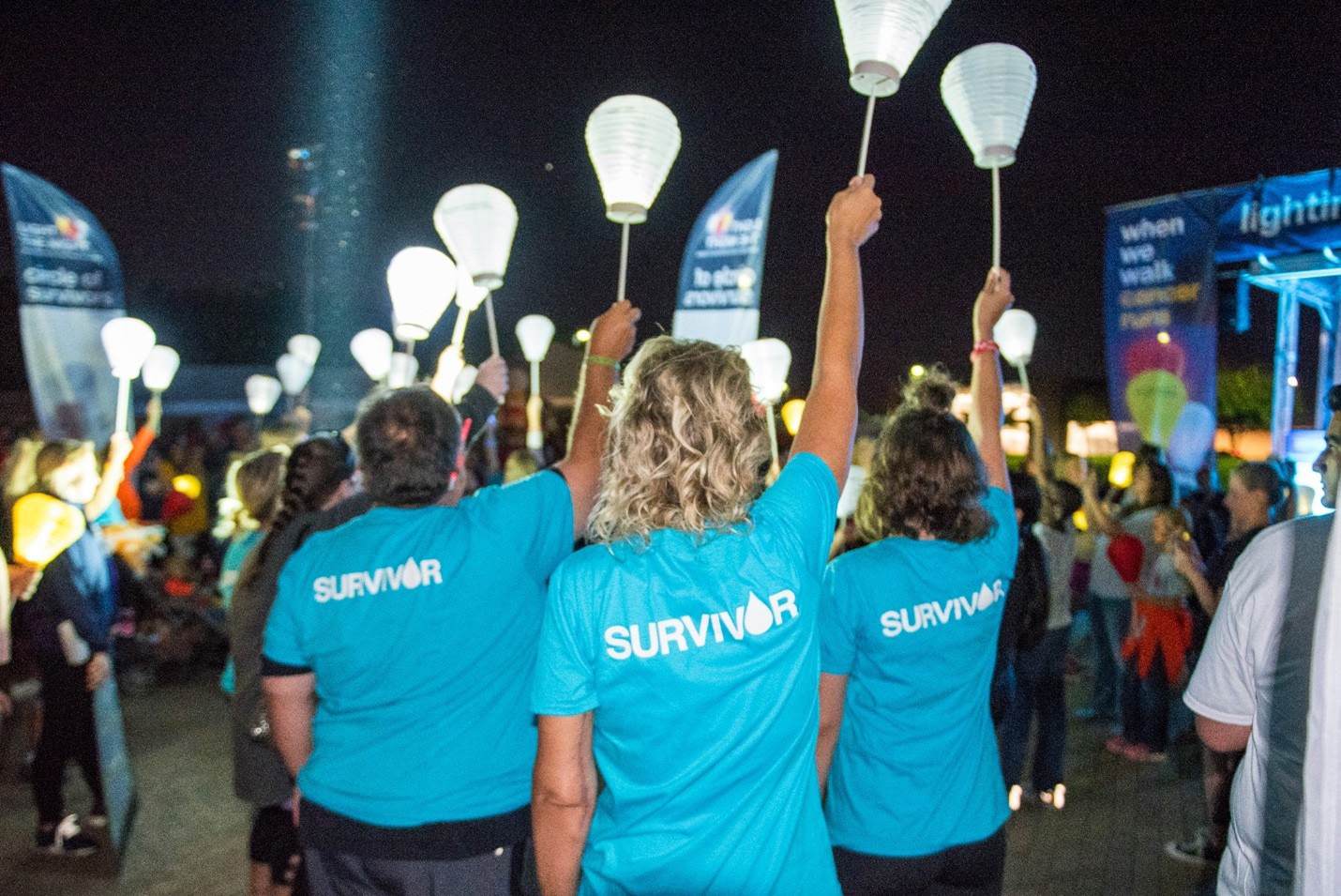 Blood cancer survivors join together in the Circle of Survivors at a Light The Night event.