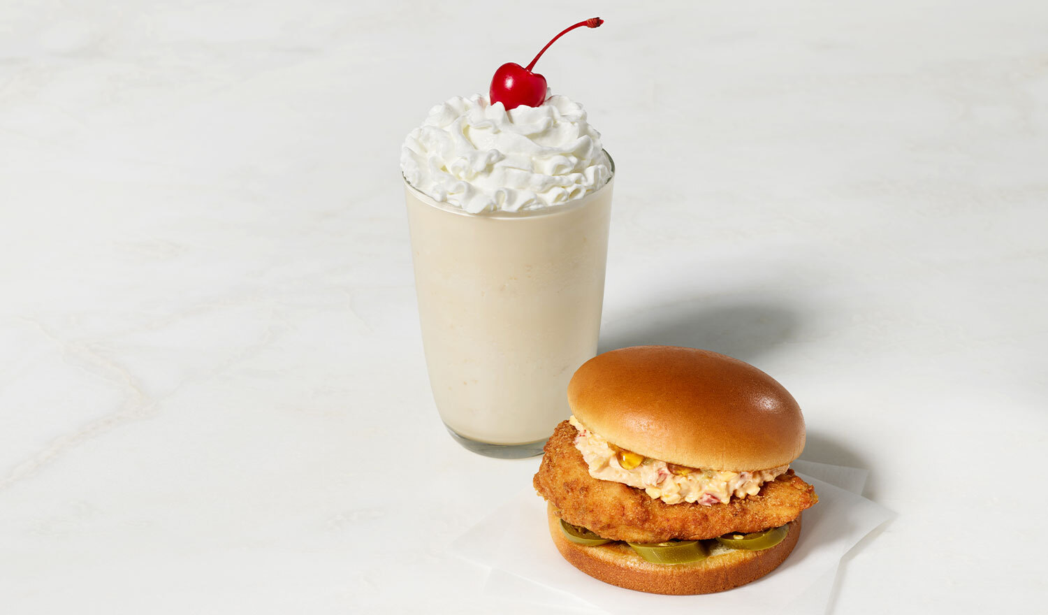 The Honey Pepper Pimento Chicken Sandwich and Caramel Crumble Milkshake will join Chick-fil-A menus nationwide beginning August 28.