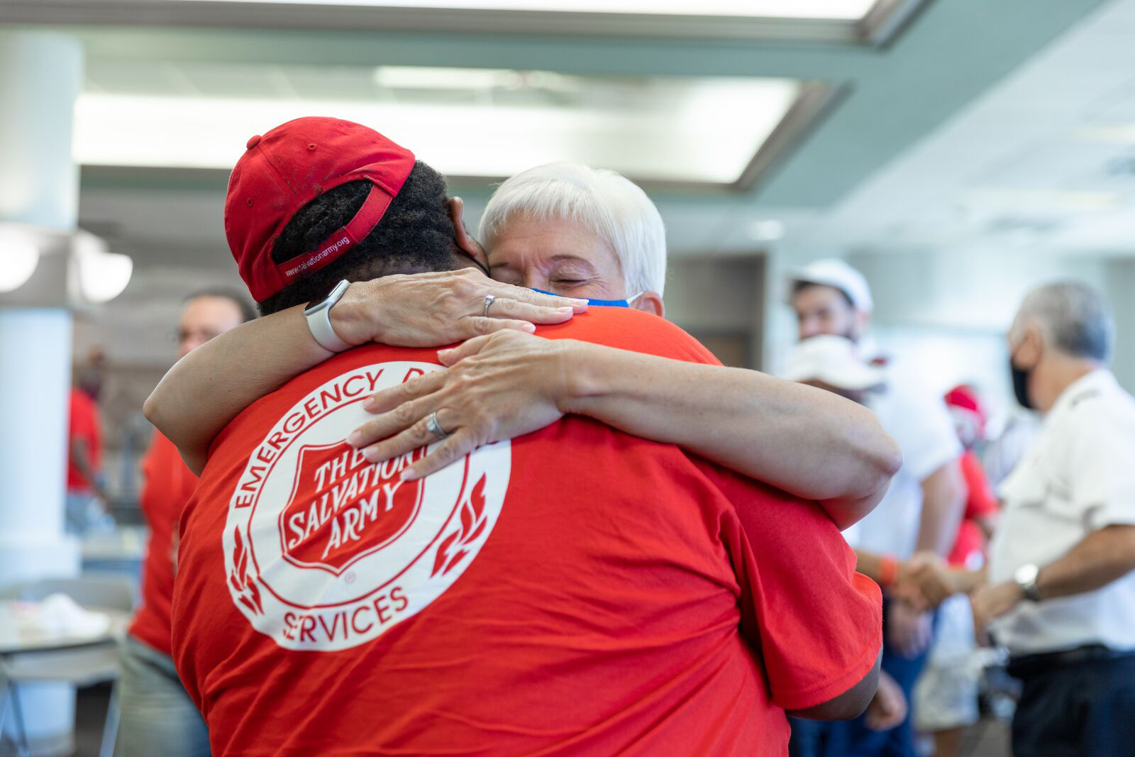 Salvation Army Emergency Disaster Services volunteer offering emotional and spiritual care to disaster survivor