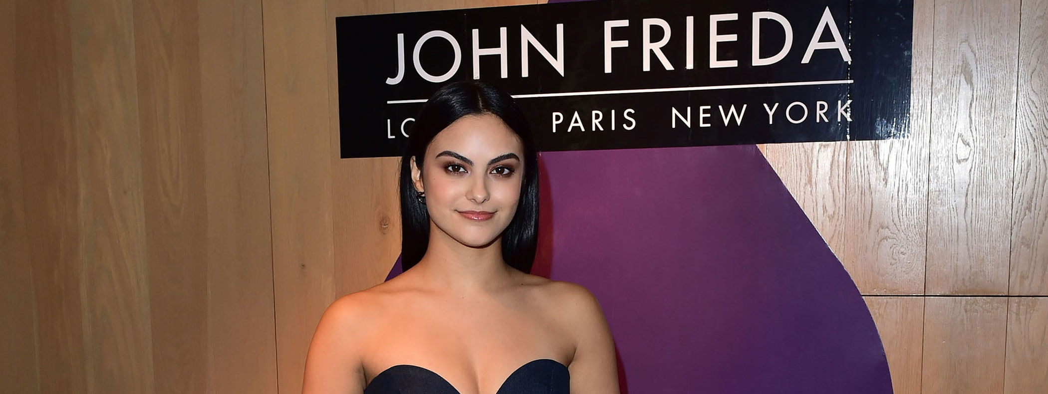 Camila Mendes standing for a photo