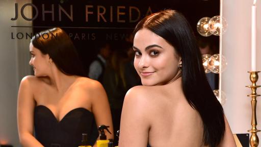 Camila Mendes in front of a mirror