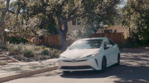 Car driving down a town street