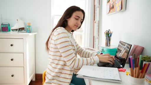 Person at desk using laptop