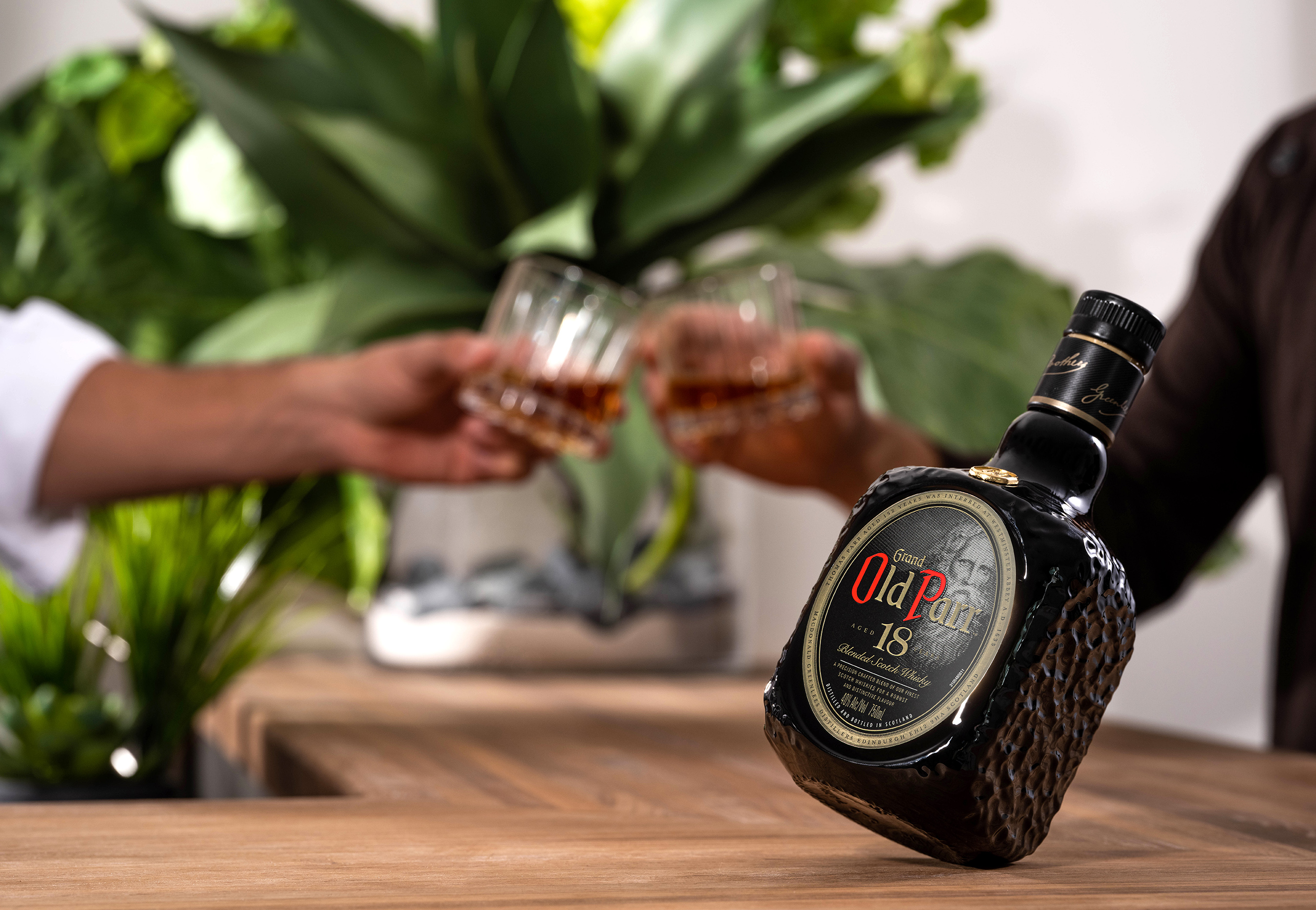 Tilted bottle on bar