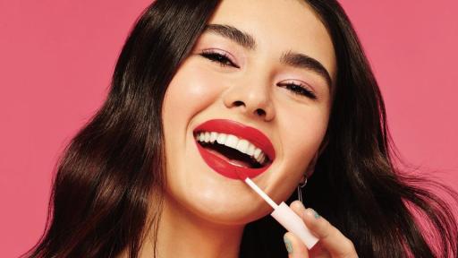Woman applying Red Velvet makeup