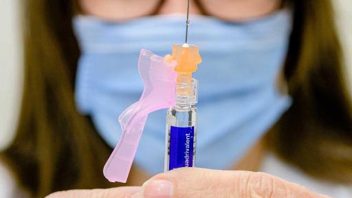 Shoppers Drug Mart pharmacist prepares flu shot