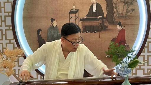 Man playing an instrument on stage.