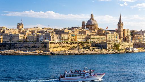 Image of a passenger boat passing through Marsamxett Harbour, Malta.