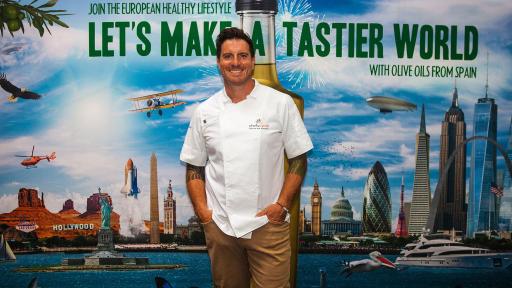 Chef Seamus Mullen posing with the campaign image