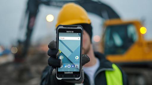 Image of man holding up the The Nautiz X6. The Nautiz X6 has an expansive 6-inch touchscreen display that’s sunlight-readable and protected by super-hardened Gorilla Glass.