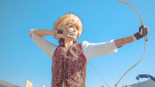 Image of a woman doing archery.