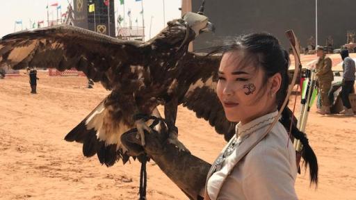 Image of woman holding bird.