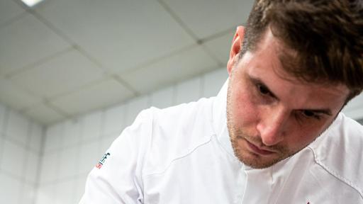 Image of  Levente Koppány cooking during the regional final in Hamburg
