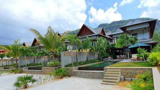 Image of lush green backdrop of mountains and tropical forest