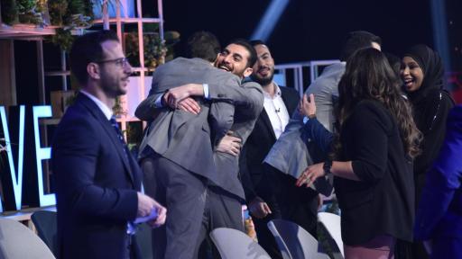 Image of Season 12 top eight candidates congratulate each other as they all advance to the engineering prototyping stage