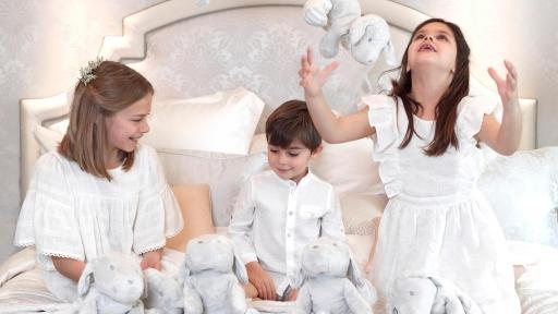 Kids on a bed playing