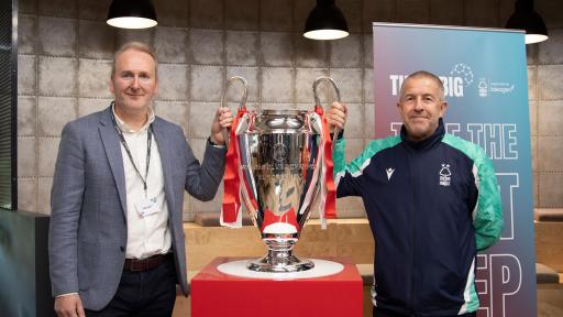 ben and graham looking to camera with the cup