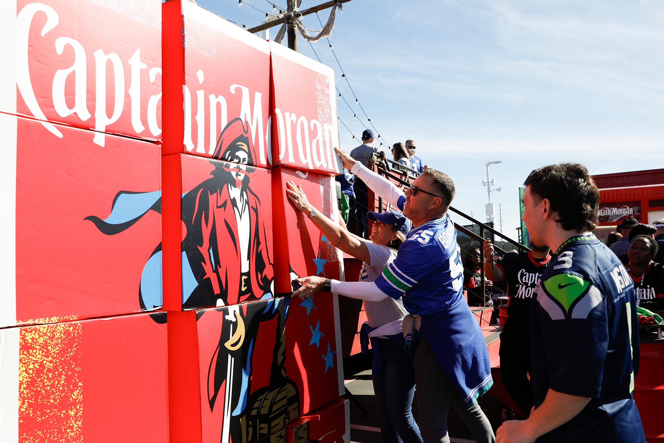 Captain Morgan, the Official Spiced Rum of SBLX, celebrates with fans at NFL Gameday Experience