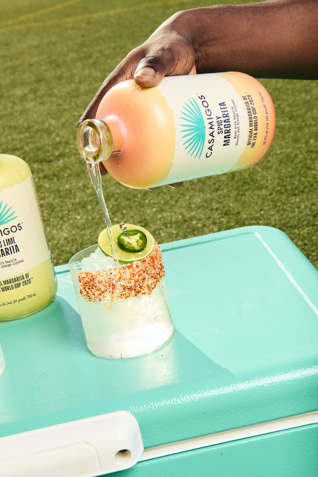 Casamigos Spicy Pre-Mixed Margarita poured over ice with a chili-salt rim and jalapeño garnish brings bold flavor to every game-day gathering.