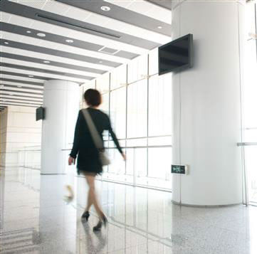 person walking in office building
