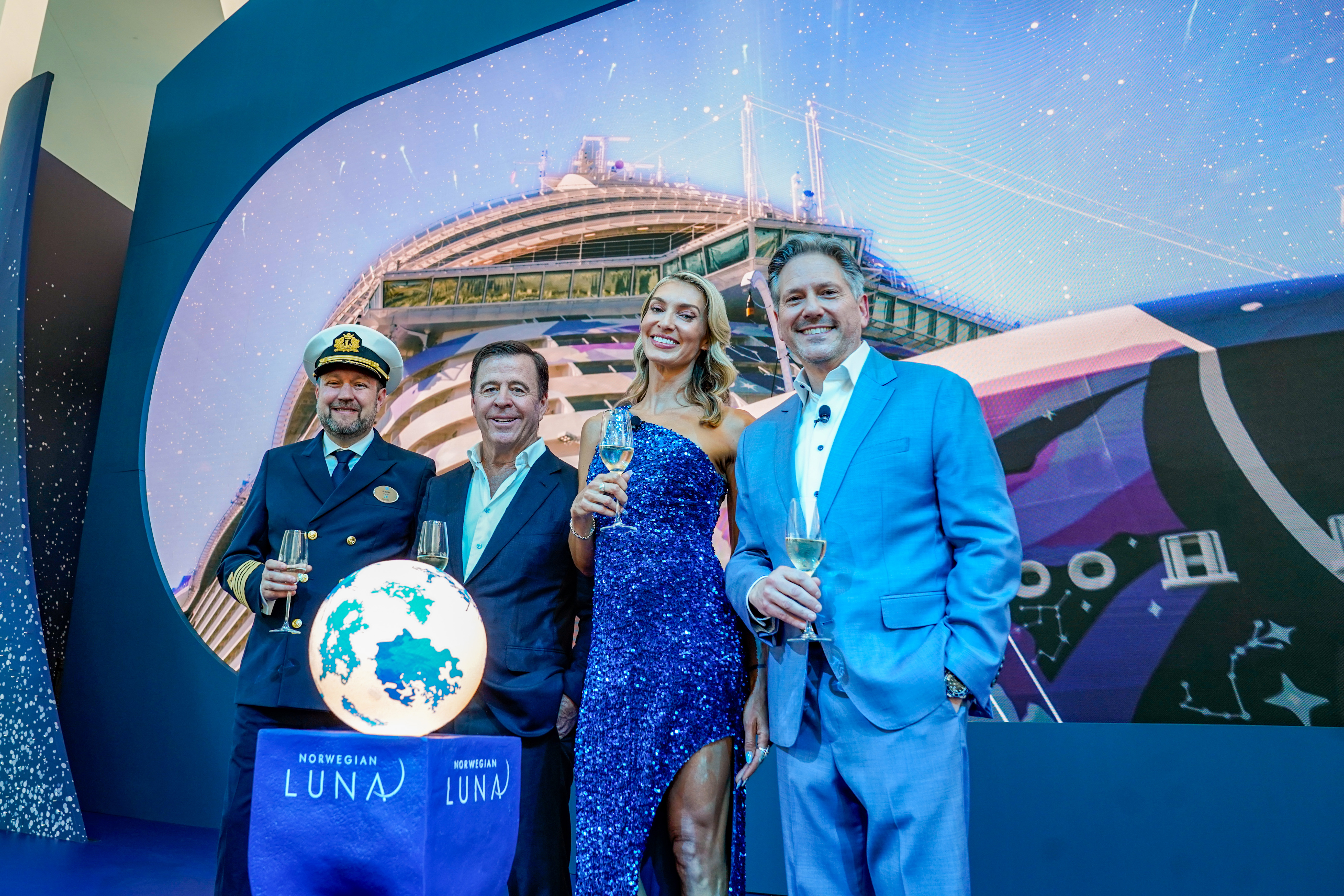 (From left to right) Robert Lundberg, Captain of Norwegian Luna™; John Chidsey, President and CEO of Norwegian Cruise Line Holdings Ltd®; ELLE, hull artist and godmother of Norwegian Luna™ ; and Marc Kazlauskas, President of Norwegian Cruise Line® at the ship's christening ceremony at the Company's LEED® Gold Certified terminal at PortMiami on Friday, March 27, 2026 in Miami, Fla.