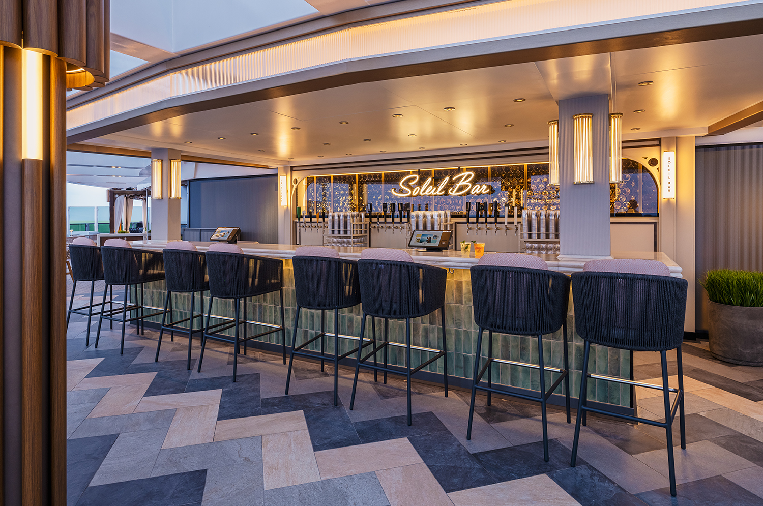 The Indulge Food Hall aboard Norwegian Luna™ includes the Soleil Bar with outdoor seating and breathtaking views from the aft of the ship.