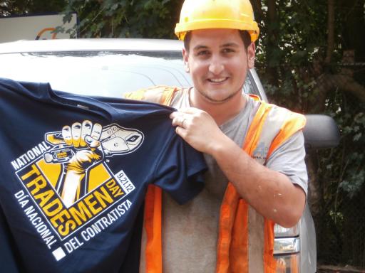 A skilled tradesman takes a break from his work to show off his National Tradesmen Day T-shirt.