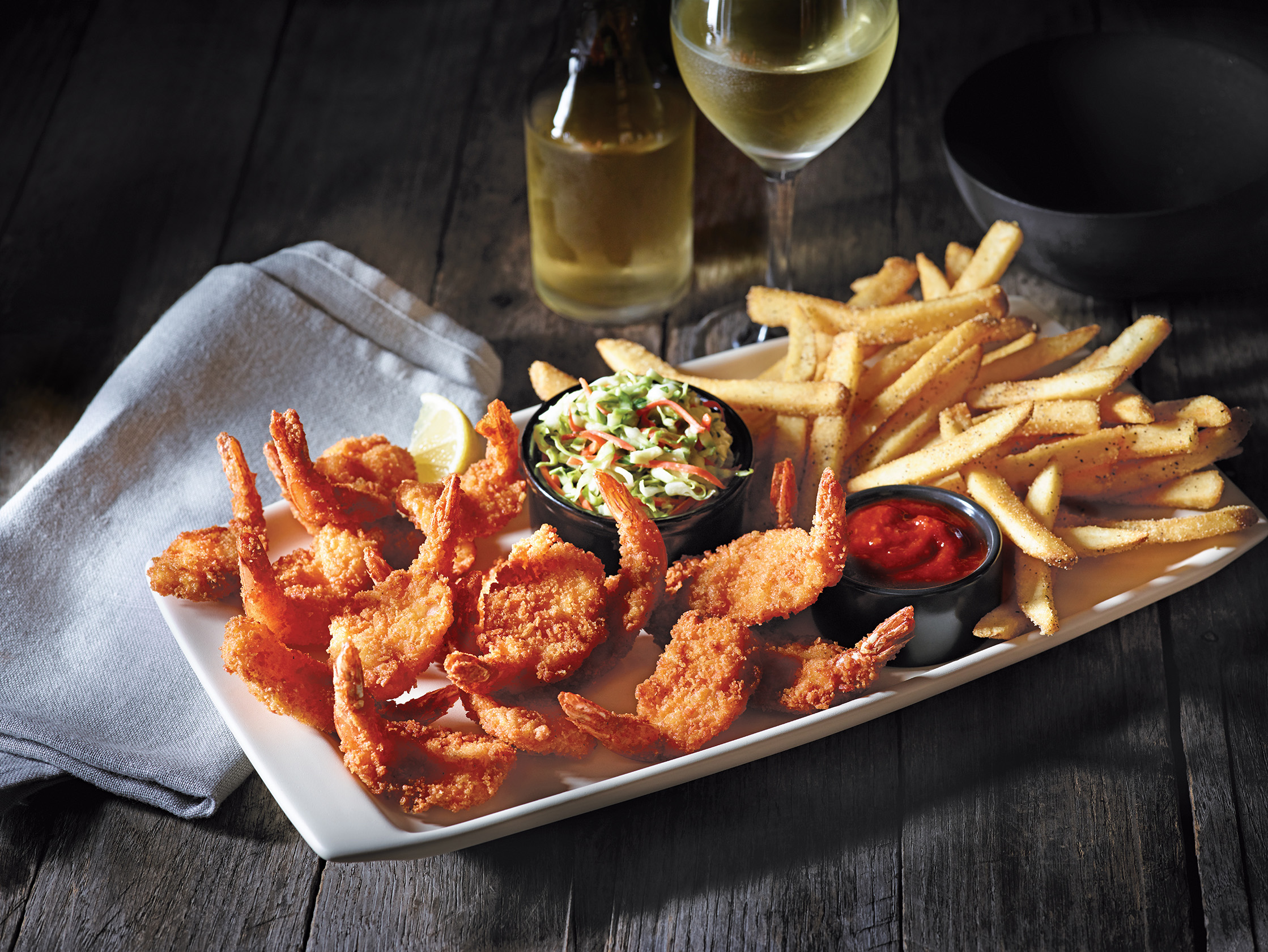 A generous portion of succulent shrimp, golden fried to crunchy perfection and served with fries, cole slaw and cocktail sauce.