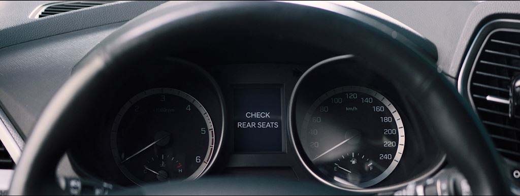 THE SYSTEM FIRST REMINDS DRIVERS TO CHECK THE REAR SEATS WHEN EXITING THE VEHICLE WITH A MESSAGE ON THE CENTER INSTRUMENT CLUSTER DISPLAY.