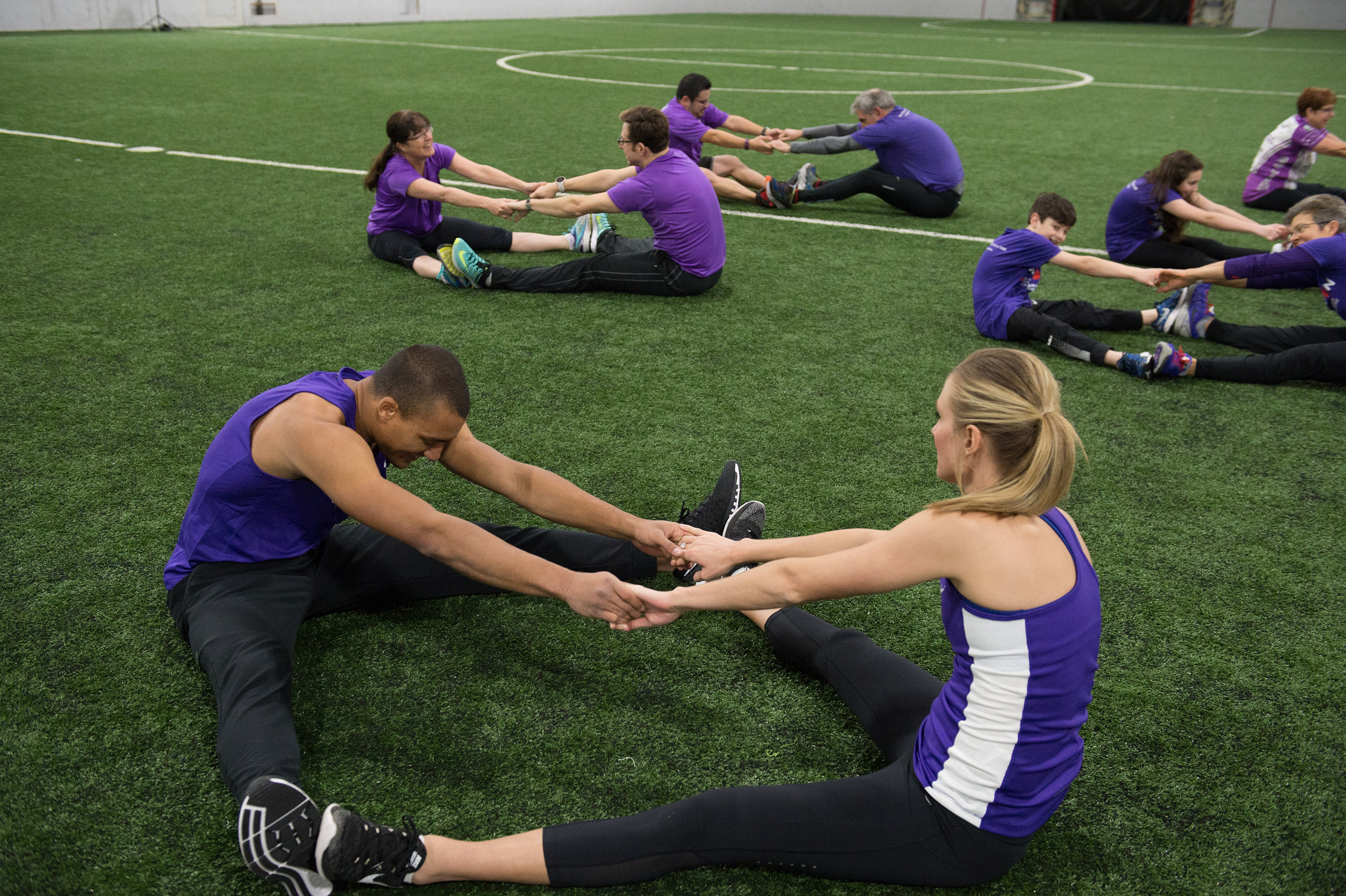 The Eatons warming up with Team In Training teammates