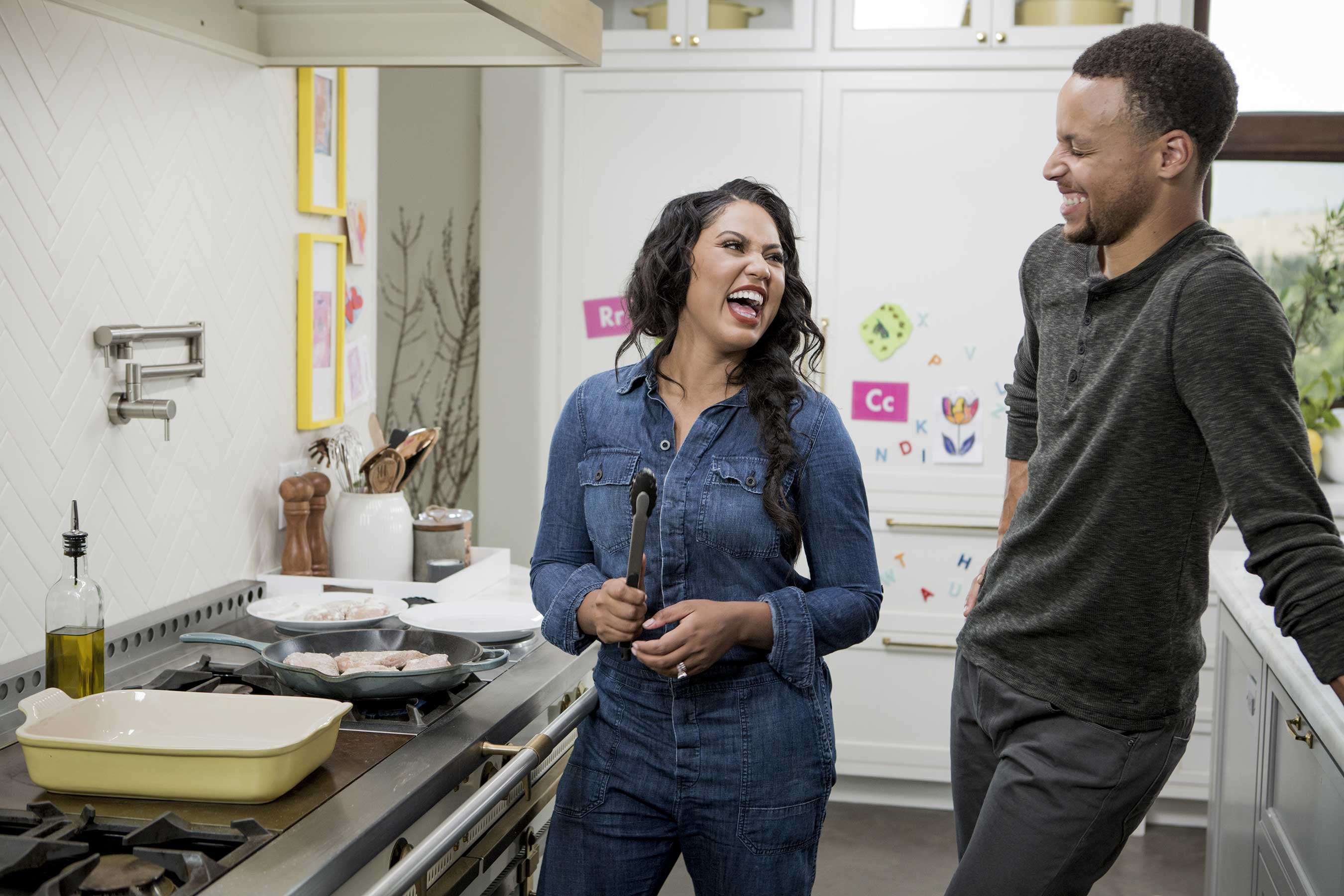 Ayesha Curry and husband Stephen Curry in the kitchen on Food Network's Ayesha's Homemade