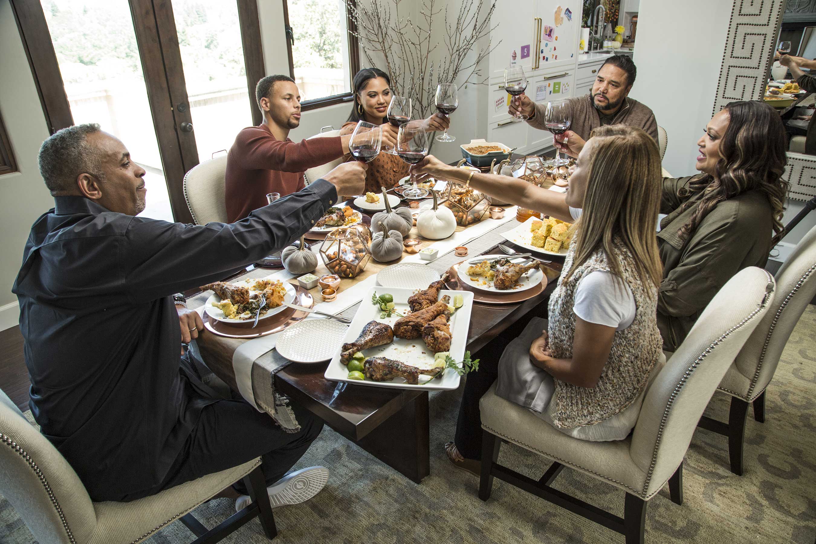 Ayesha Curry with her husband Stephen Curry and parents and in-laws on Food Network's Ayesha's Homemade