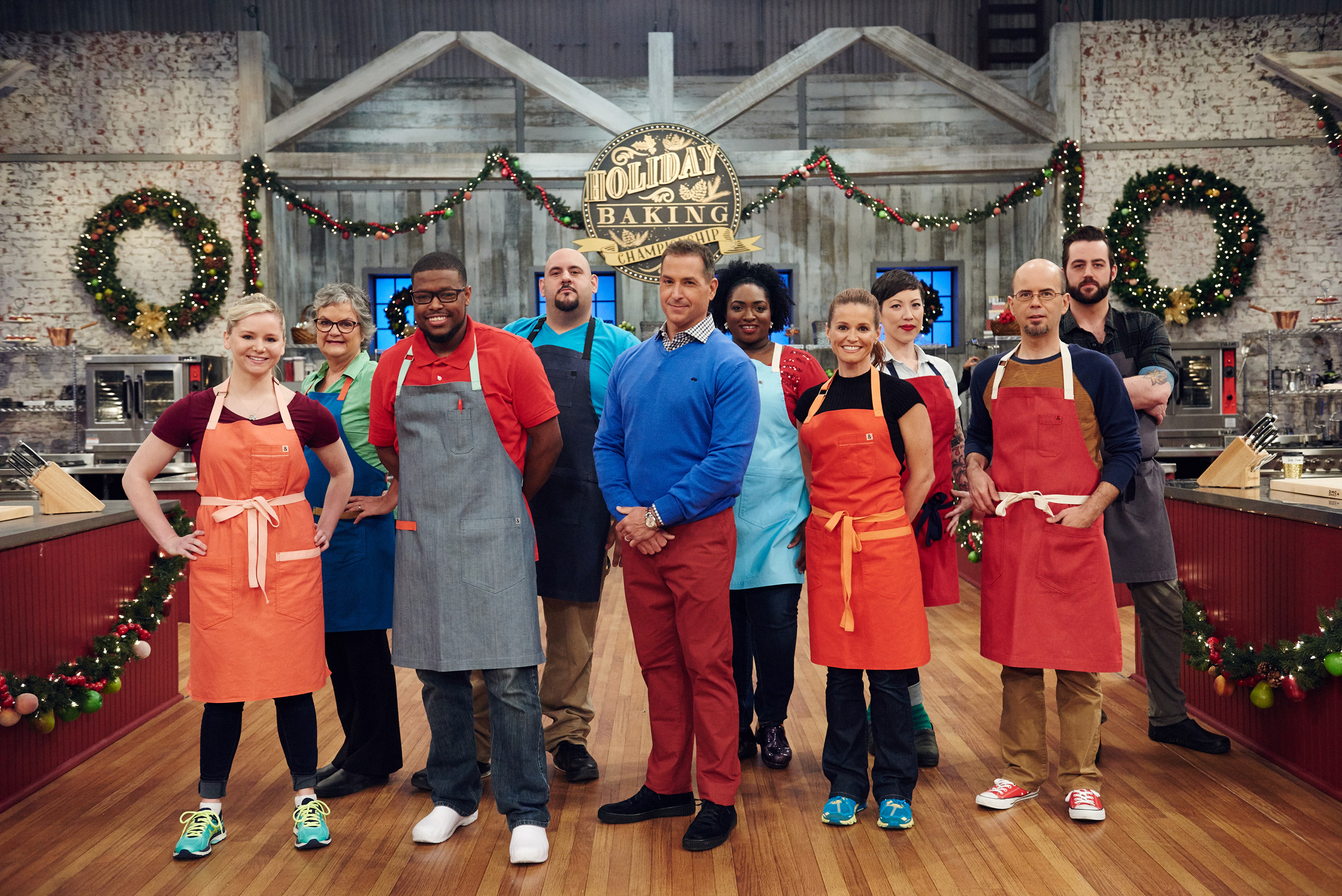 Host Bobby Deen with the contestants of Food Network's Holiday Baking Championship