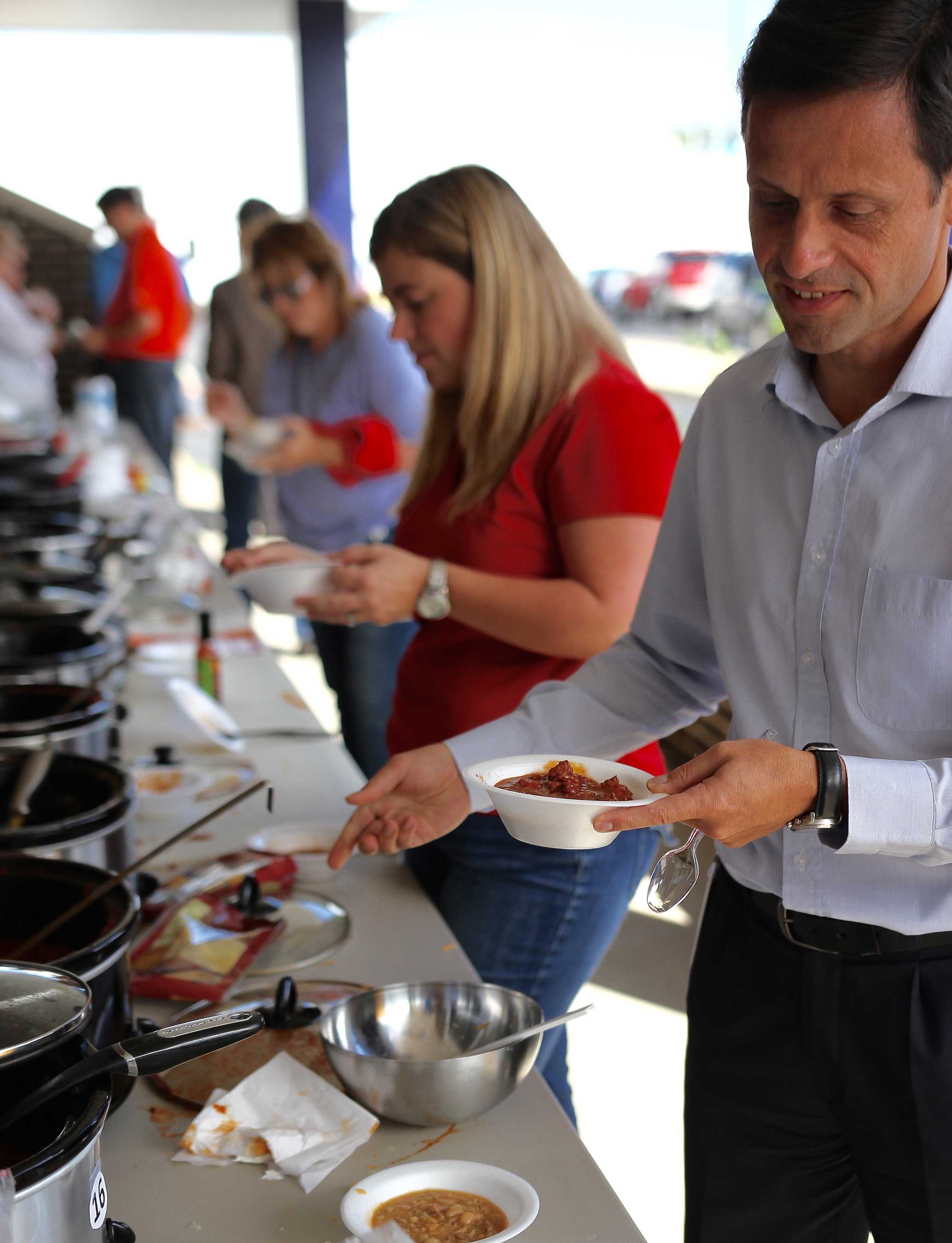 A big hit in Columbus, Indiana, Faurecia employees participate in an annual chili cook-off to raise money and donations for FUELS local food bank partner, the Love Chapel.