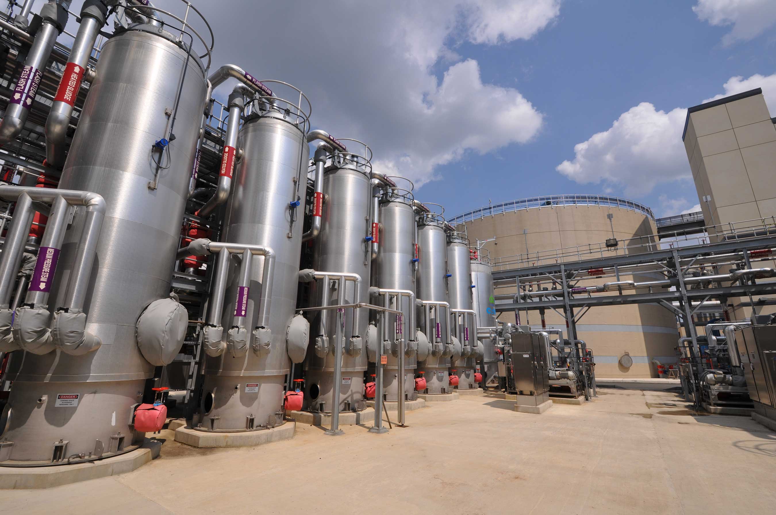 CAMBI thermal hydrolysis vessels in foreground, anaerobic digesters in the background.