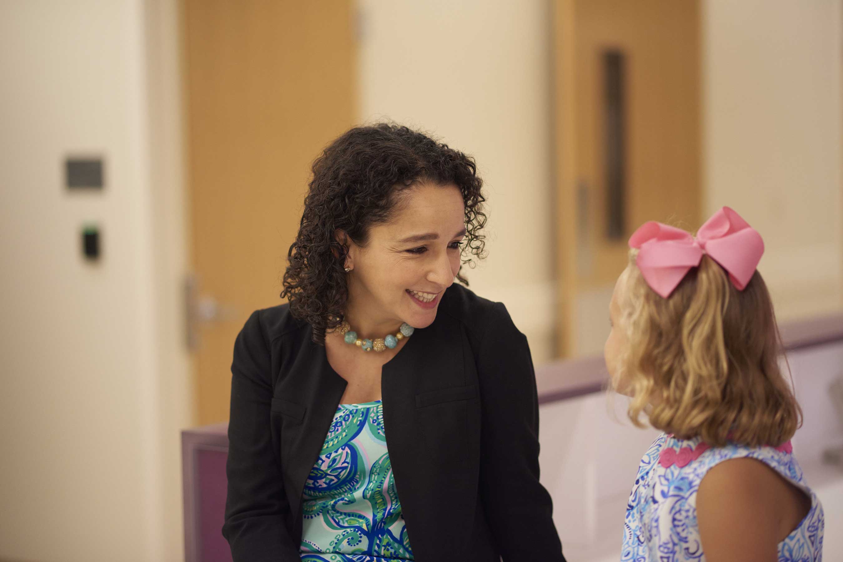 Dr. Yael Mossé and Edie Gilger share a laugh at Children’s Hospital of Philadelphia. Dr. Mossé developed a lifesaving cancer cure for Edie and her mother, and all three will be honored on Northwestern Mutual’s 2017 Rose Parade® float.