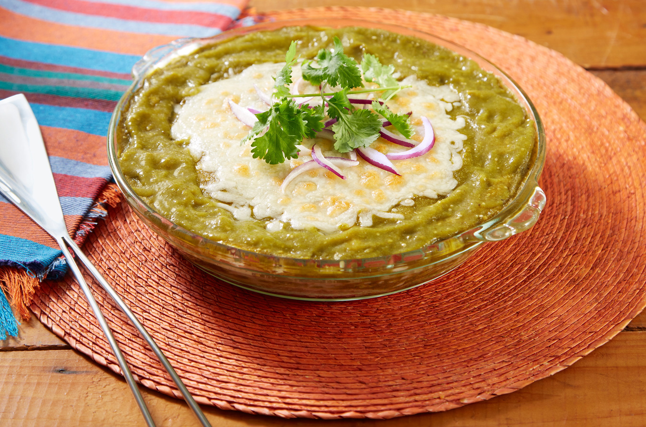 Inspired by cuisines of Guatemala and Mexico, this layered chicken, Oaxaca cheese, corn tortilla and tomatillo-cilantro sauce will compliment any occasion.
