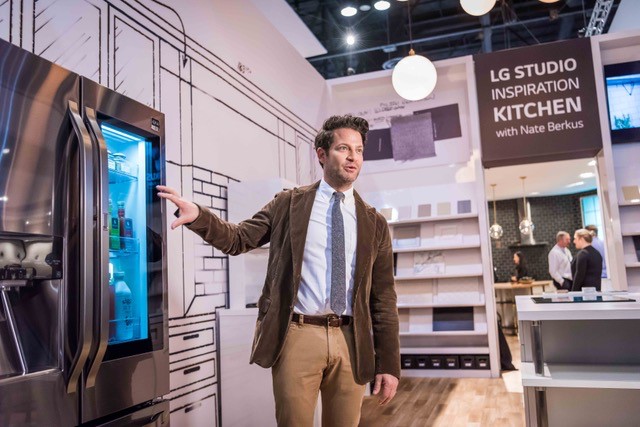 LG STUDIO Artistic Advisor and renowned designer Nate Berkus demonstrates the new LG STUDIO InstaView Refrigerator in a black stainless steel finish. A sleek glass panel on the right door illuminates with two quick knocks revealing the contents inside, at the Kitchen and Bath Show on Tuesday, January 10, 2016 in Orlando, FL. (Roberto Gonzalez/AP Images for LG)
