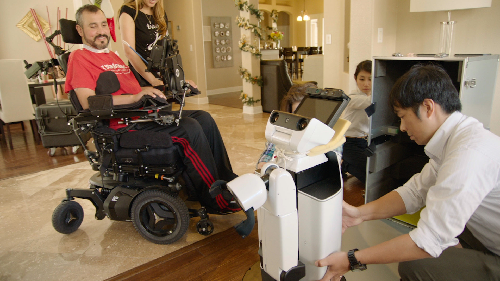 U.S. Veteran Romy Camargo welcomes Toyota into his home for the first in-home trial of the company's Human Support Robot (HSR). The HSR is one of the “partner robots” Toyota is developing to help people with limited mobility. U.S. Veteran Romy Camargo welcomes Toyota into his home for the first in-home trial of the company's Human Support Robot (HSR). The HSR is one of the “partner robots” Toyota is developing to help people with limited mobility.