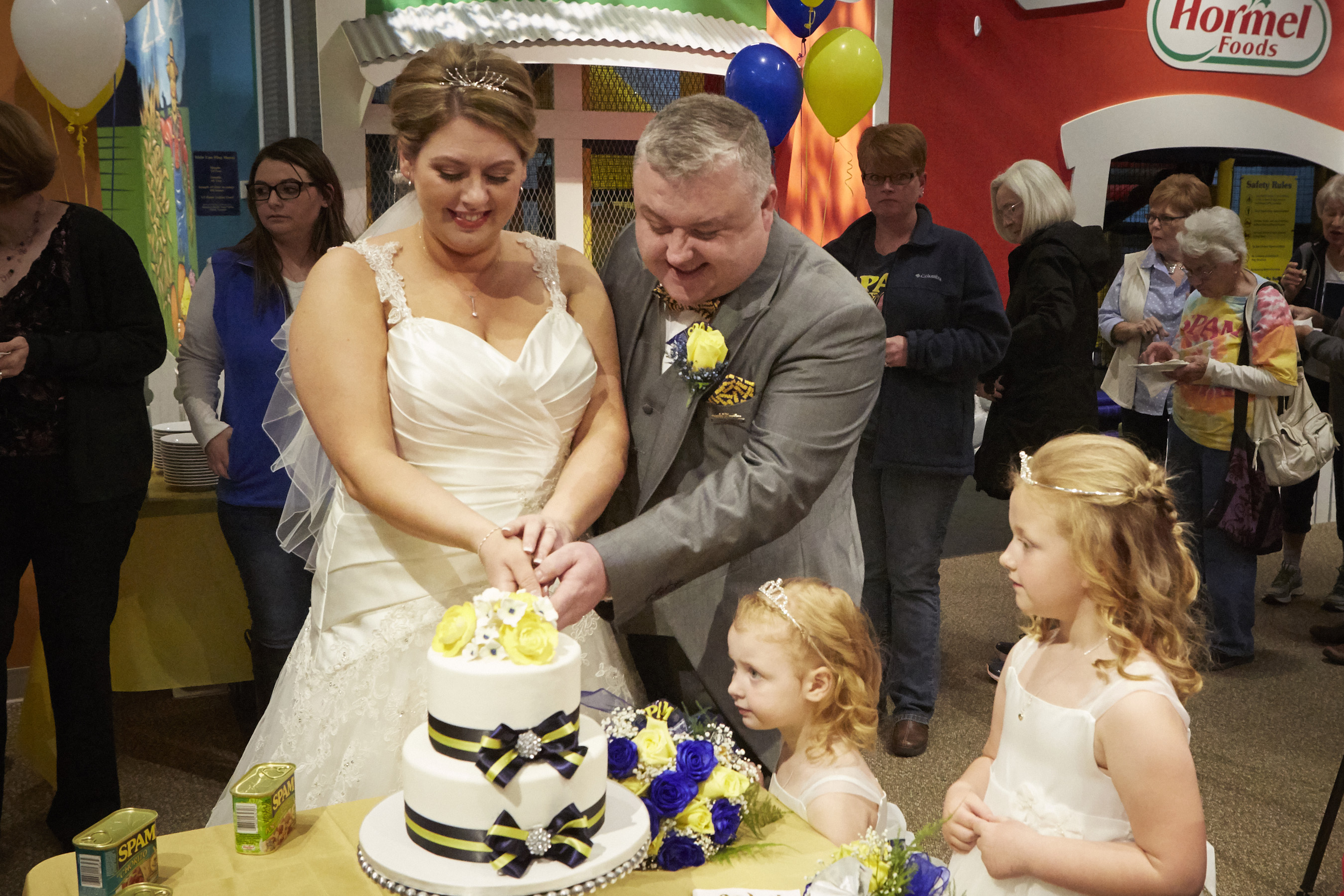 The newlyweds cutting their cake following the ceremony at the SPAM Museum