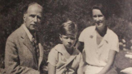 An old black and white photo of Robbie and parents 1935