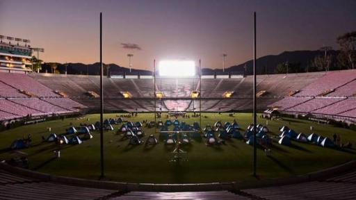 Tents on the Rose Bowl Stadium field at night