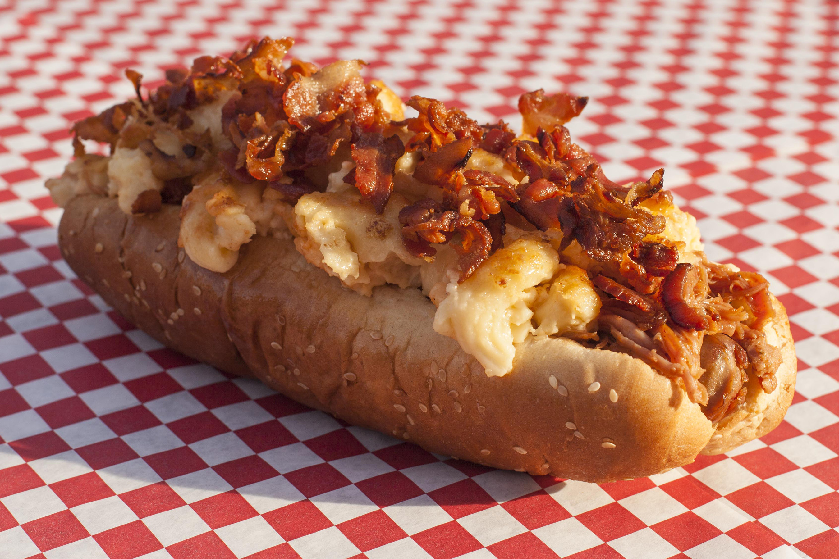 The Granddaddy Dog features a quarter-pound hot dog topped with mac-n-cheese, pulled pork, bacon and barbecue sauce.
