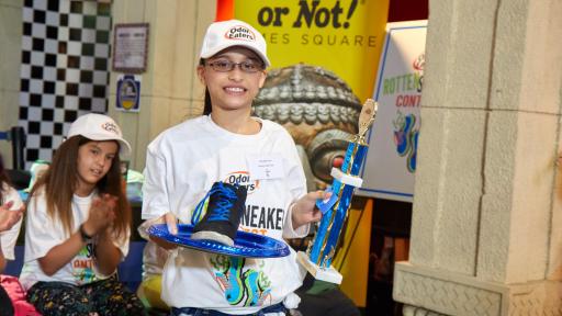 Jessnally Ortiz - Runner-up 2018 Rotten Sneaker Contest holds her trophey