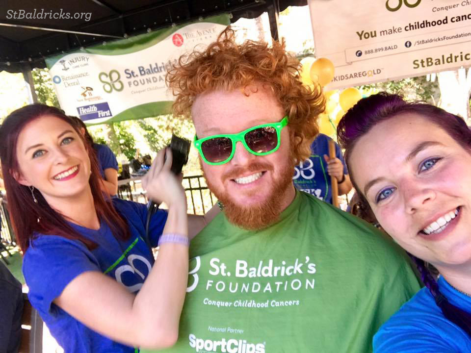 After serving as a St. Baldrick’s volunteer event photographer for several years, Casie Shimansky (right) will shave her head two days after tying the knot.