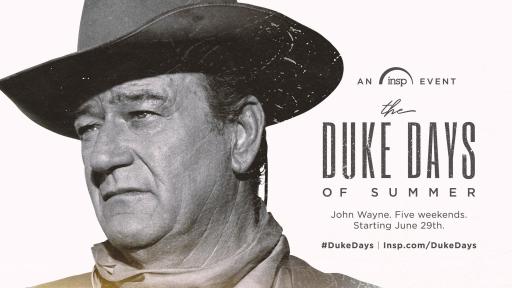 John Wayne, in cowboy hat and attire, holding a rifle.