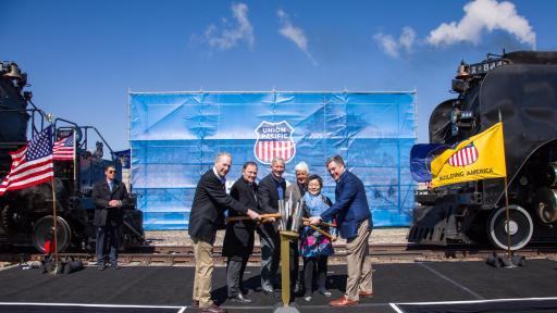 People tapping a ceremonial Golden Spike from left are Sandy Dodge, descendent of Gen. Grenville Dodge; Utah Gov. Gary Herbert, Union Pacific Chairman, President and CEO Lance Fritz, Utah Congressman Rob Bishop, Margarat Yee, a descendent of a Central Pacific employee, and Scott Moore, Union Pacific senior vice president-Corporate Relations and chief administrative officer.