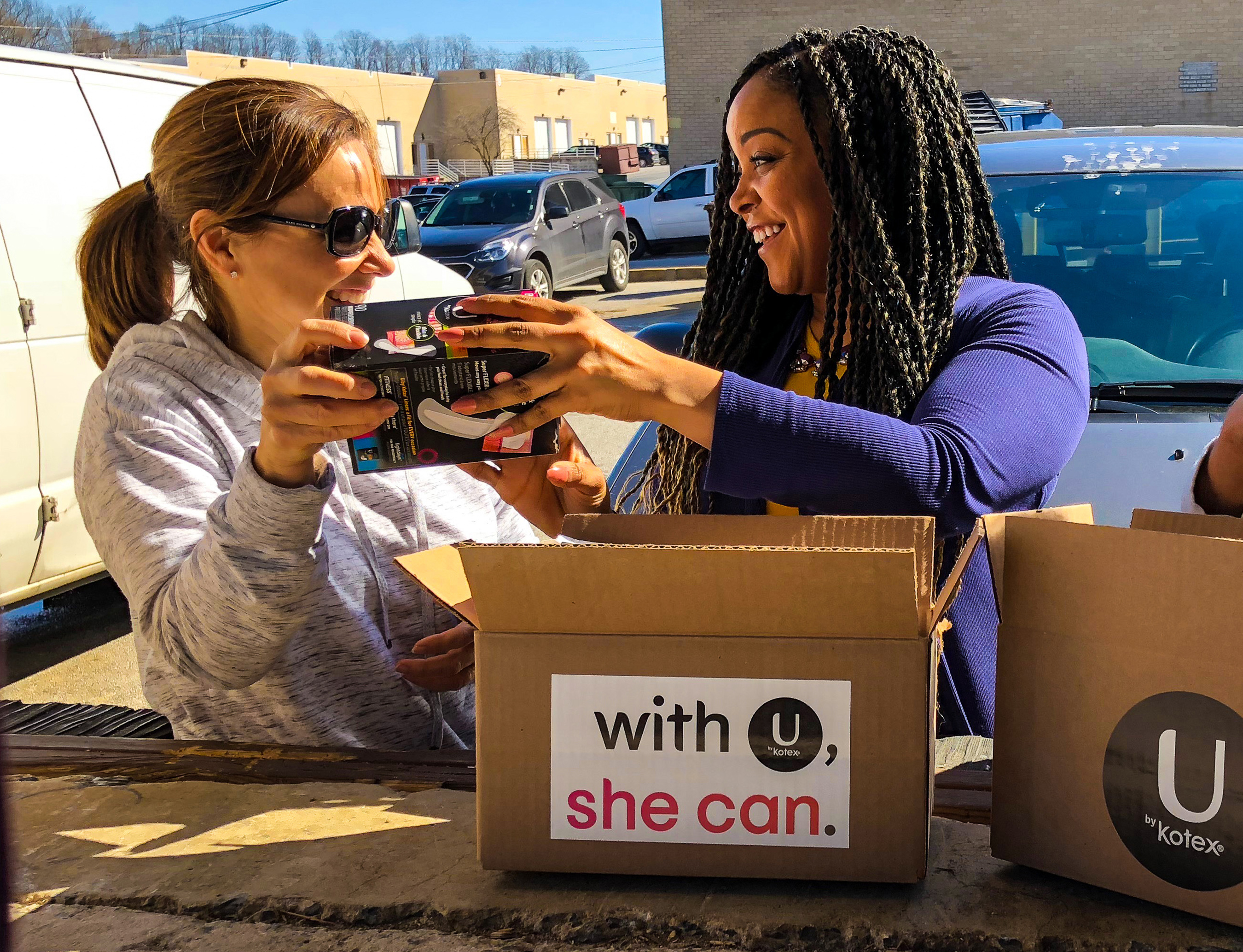 Amber Akisanya, U by Kotex® brand manager, sorts U by Kotex product with volunteer. U by Kotex® is launching With U, She Can because a period should never stand in the way of a women’s progress. Amber Akisanya, U by Kotex® brand manager, sorts U by Kotex product with volunteer. U by Kotex® is launching With U, She Can because a period should never stand in the way of a women’s progress.