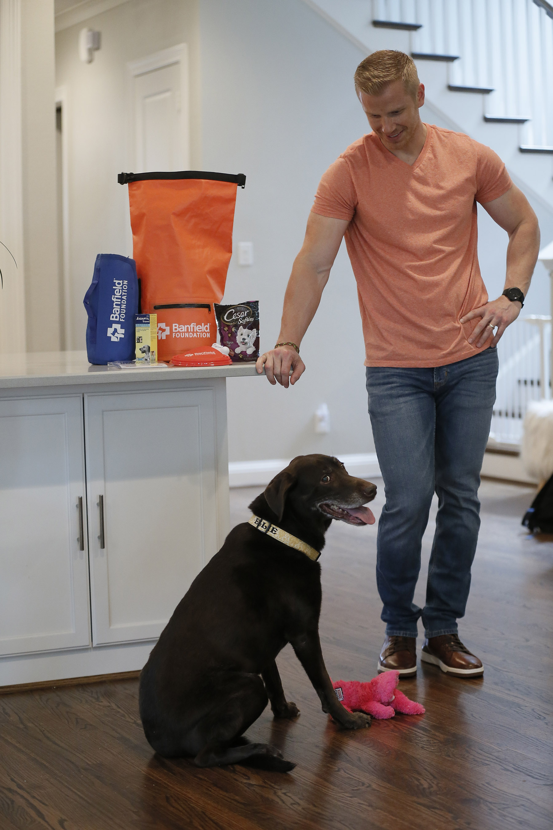 TV personality and Hurricane Harvey responder Sean Lowe shares a moment with his dog, Ellie, while filming a pet disaster preparedness PSA with the Banfield Foundation at his home in Dallas, Texas. The PSA debuted nationally on Wednesday, June 6, 2018 and educates pet owners on the simple yet potentially life-saving steps they can take for their four-legged family members before disaster strikes. (Photo credit: Brandon Wade/AP Images for the Banfield Foundation)